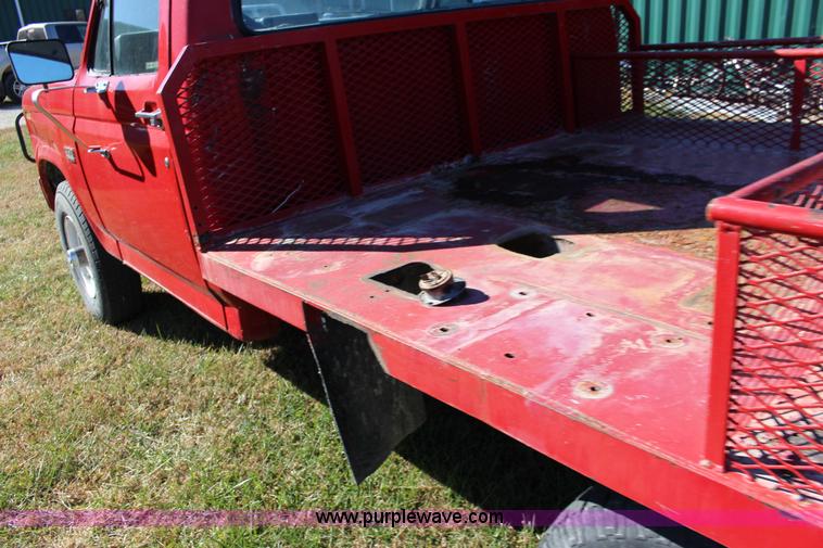 image for item J7499 1984 Ford F350 flatbed pickup truck
