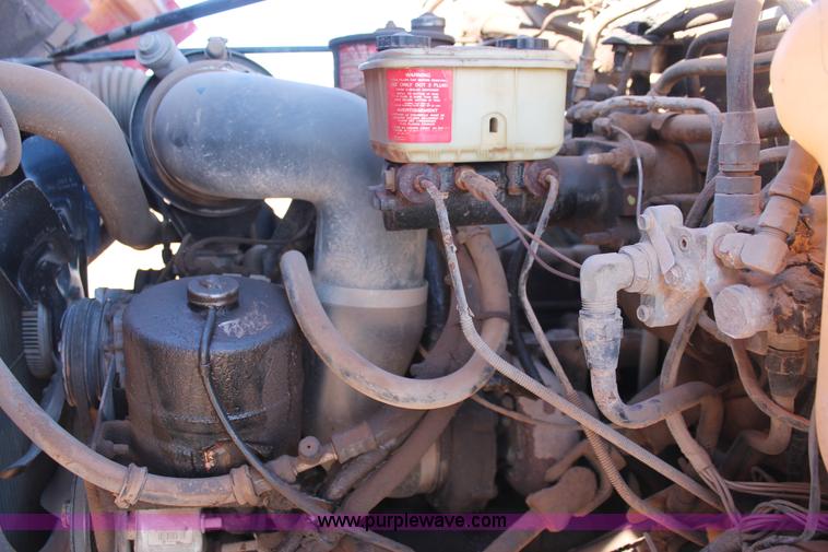 image for item H8037 1989 Ford F700 flatbed truck