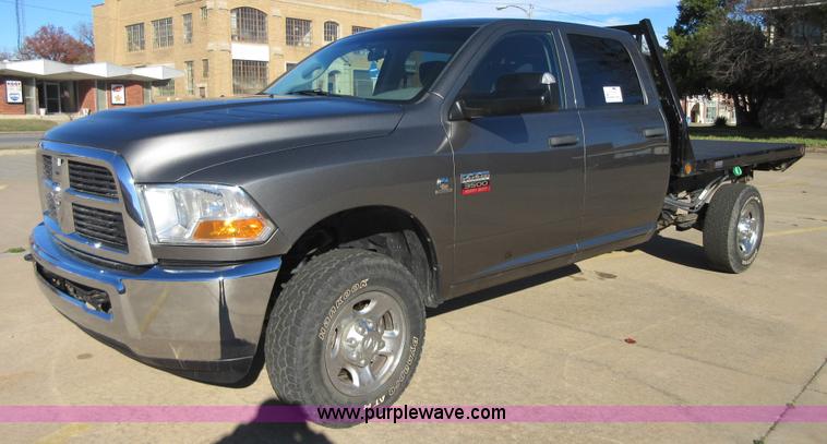 image for item I1845 2011 Dodge Ram 3500 Crew Cab flatbed pickup truck