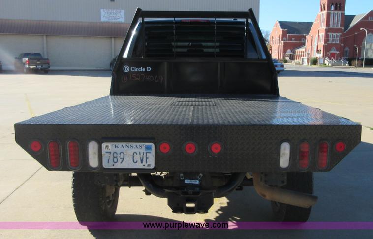 image for item I1845 2011 Dodge Ram 3500 Crew Cab flatbed pickup truck