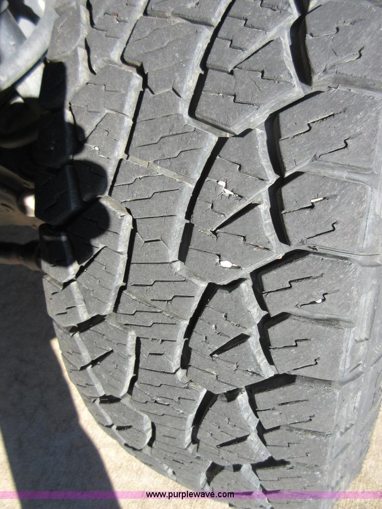 image for item I1845 2011 Dodge Ram 3500 Crew Cab flatbed pickup truck