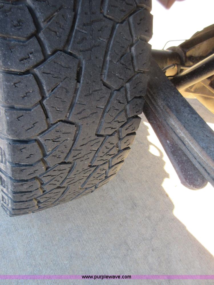 image for item I1845 2011 Dodge Ram 3500 Crew Cab flatbed pickup truck