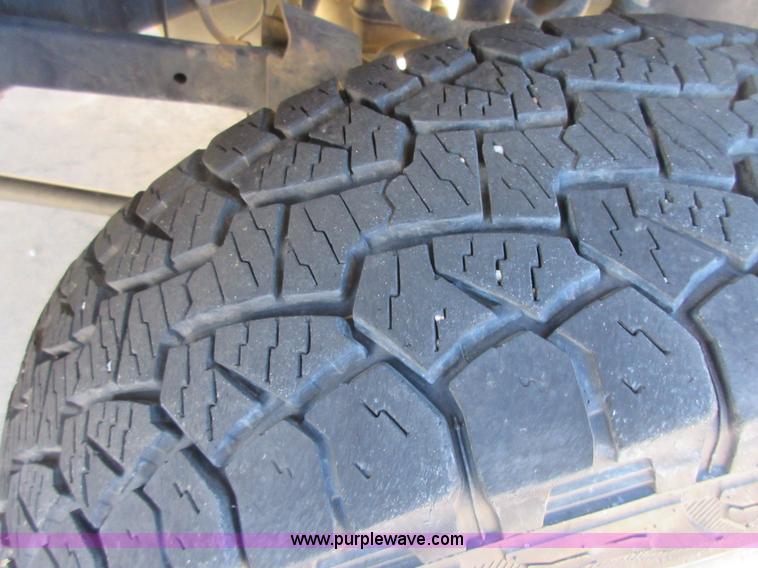 image for item I1845 2011 Dodge Ram 3500 Crew Cab flatbed pickup truck