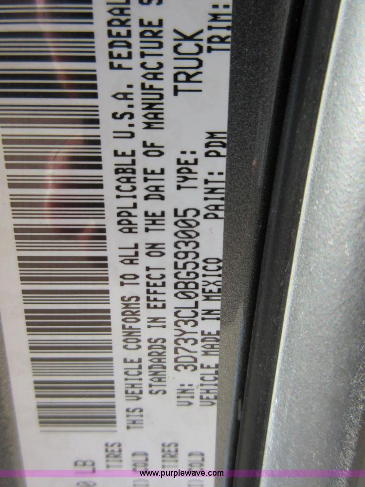 image for item I1845 2011 Dodge Ram 3500 Crew Cab flatbed pickup truck