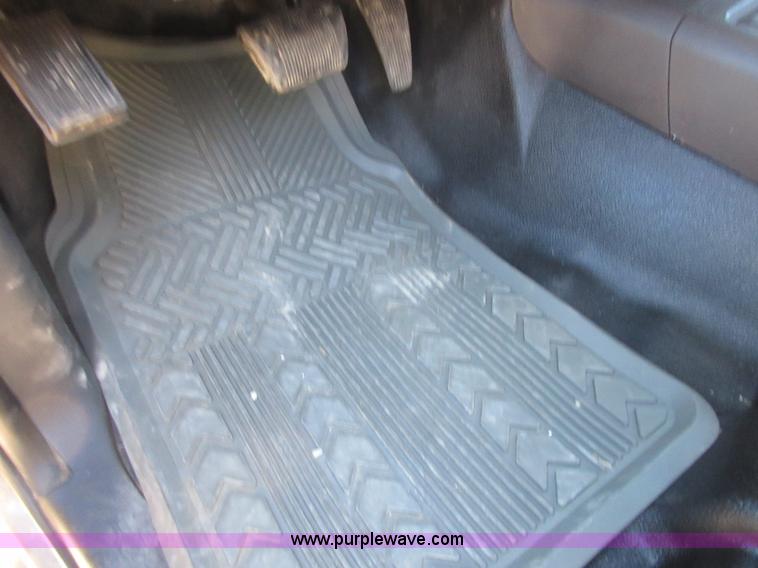 image for item I1845 2011 Dodge Ram 3500 Crew Cab flatbed pickup truck