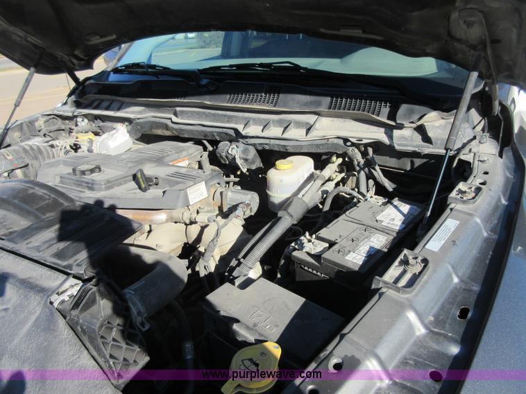 image for item I1845 2011 Dodge Ram 3500 Crew Cab flatbed pickup truck