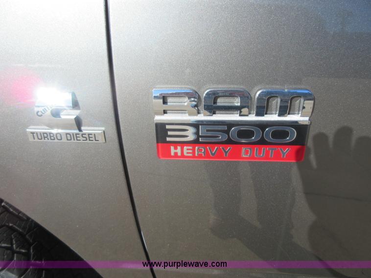 image for item I1845 2011 Dodge Ram 3500 Crew Cab flatbed pickup truck