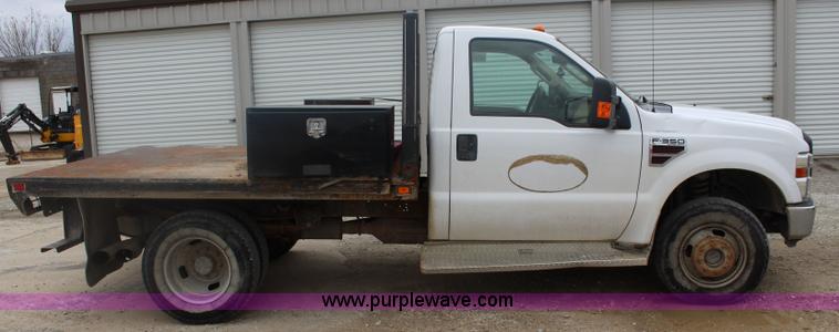 image for item J4583 2008 Ford F350 Super Duty flatbed pickup truck