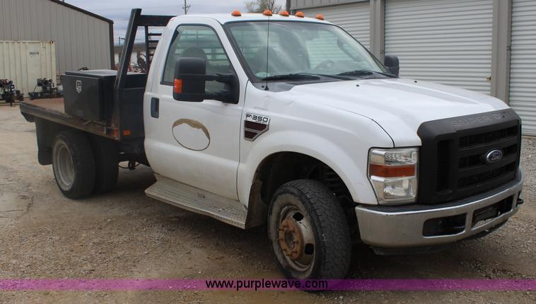 image for item J4583 2008 Ford F350 Super Duty flatbed pickup truck