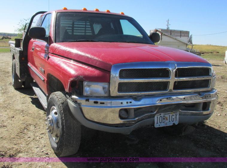image for item K2231 2001 Dodge Ram 3500 Quad Cab flatbed pickup truck