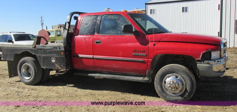 image for item K2231 2001 Dodge Ram 3500 Quad Cab flatbed pickup truck