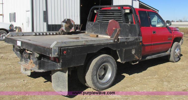 image for item K2231 2001 Dodge Ram 3500 Quad Cab flatbed pickup truck
