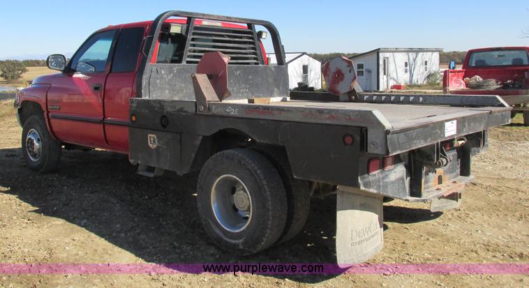 image for item K2231 2001 Dodge Ram 3500 Quad Cab flatbed pickup truck