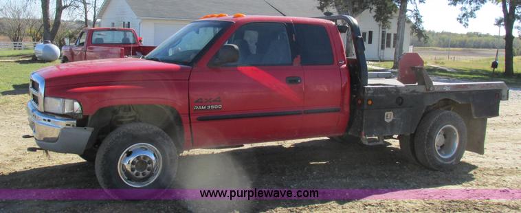 image for item K2231 2001 Dodge Ram 3500 Quad Cab flatbed pickup truck