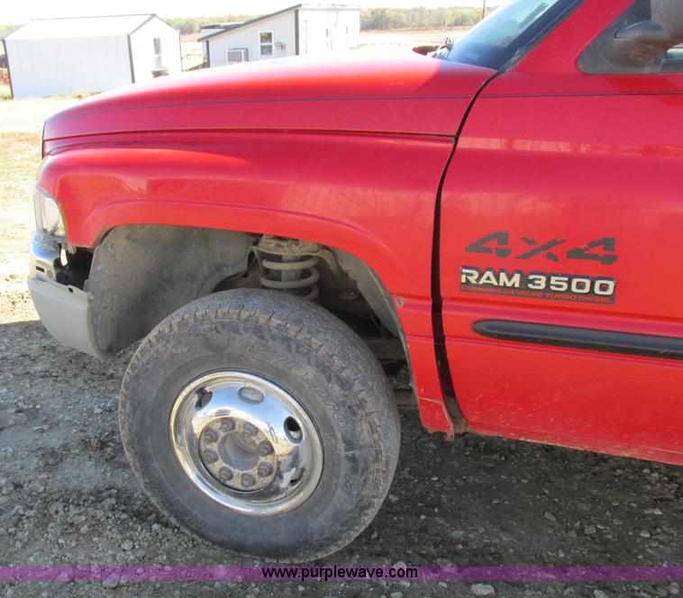 image for item K2231 2001 Dodge Ram 3500 Quad Cab flatbed pickup truck