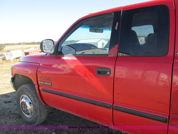 image for item K2231 2001 Dodge Ram 3500 Quad Cab flatbed pickup truck