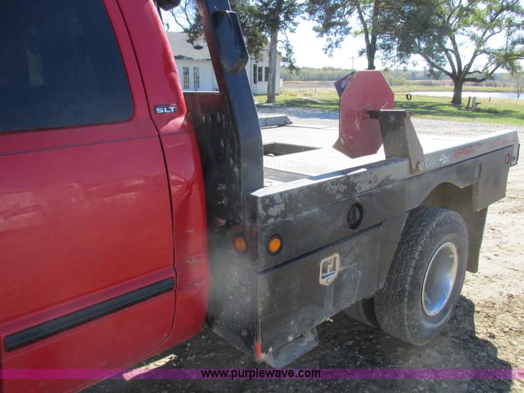 image for item K2231 2001 Dodge Ram 3500 Quad Cab flatbed pickup truck