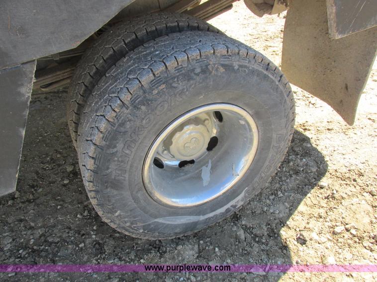 image for item K2231 2001 Dodge Ram 3500 Quad Cab flatbed pickup truck