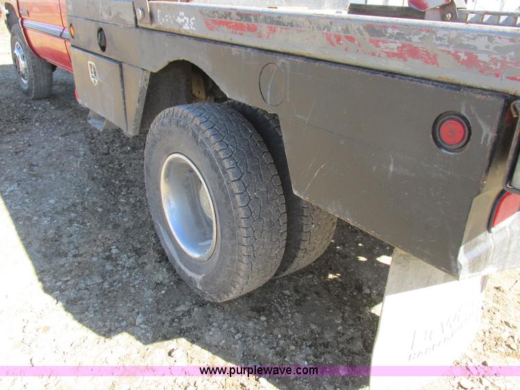 image for item K2231 2001 Dodge Ram 3500 Quad Cab flatbed pickup truck