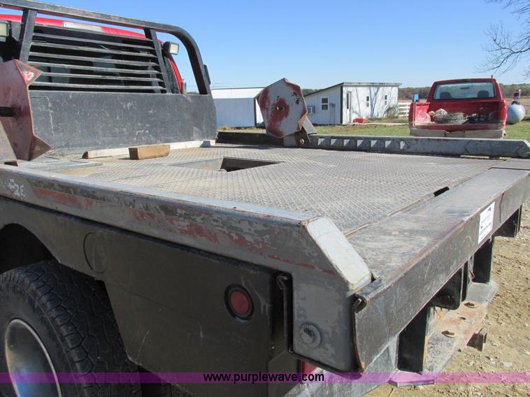 image for item K2231 2001 Dodge Ram 3500 Quad Cab flatbed pickup truck