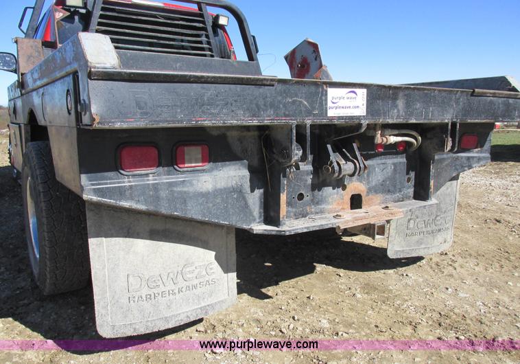 image for item K2231 2001 Dodge Ram 3500 Quad Cab flatbed pickup truck