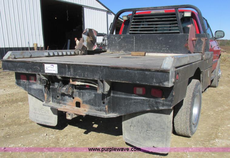 image for item K2231 2001 Dodge Ram 3500 Quad Cab flatbed pickup truck