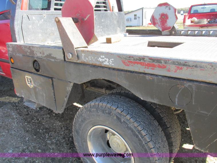 image for item K2231 2001 Dodge Ram 3500 Quad Cab flatbed pickup truck