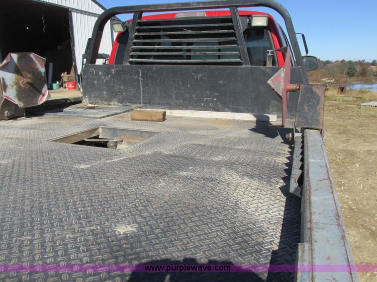 image for item K2231 2001 Dodge Ram 3500 Quad Cab flatbed pickup truck