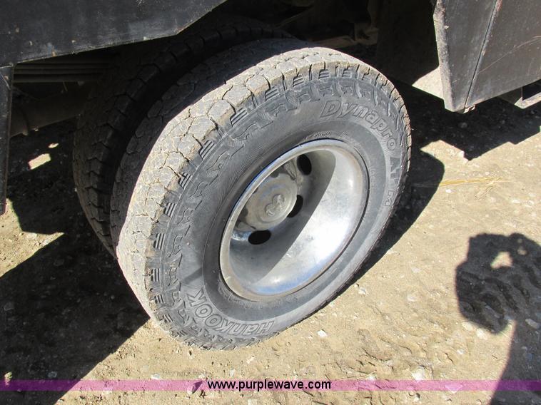 image for item K2231 2001 Dodge Ram 3500 Quad Cab flatbed pickup truck