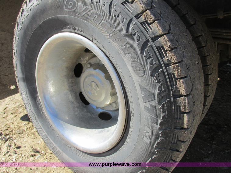 image for item K2231 2001 Dodge Ram 3500 Quad Cab flatbed pickup truck