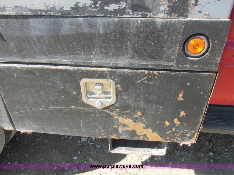 image for item K2231 2001 Dodge Ram 3500 Quad Cab flatbed pickup truck