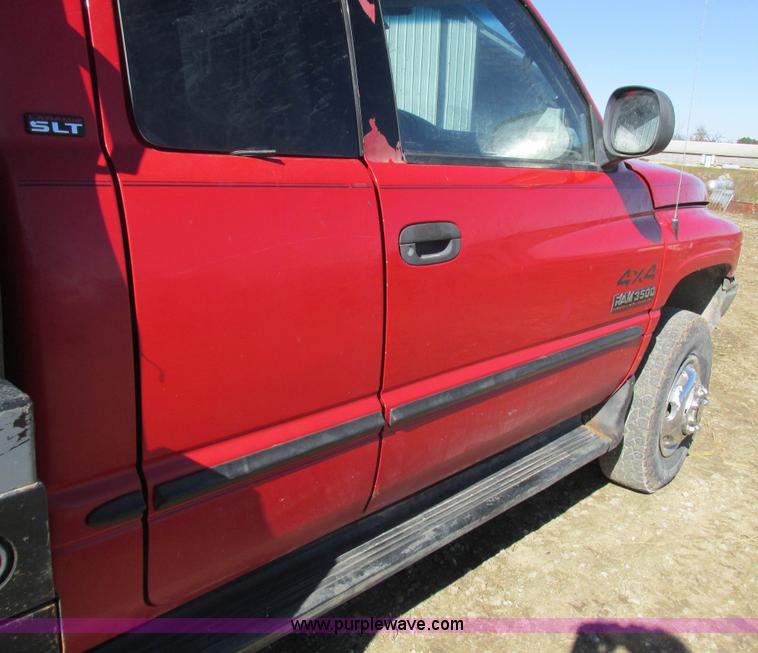 image for item K2231 2001 Dodge Ram 3500 Quad Cab flatbed pickup truck