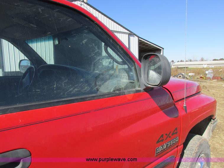 image for item K2231 2001 Dodge Ram 3500 Quad Cab flatbed pickup truck