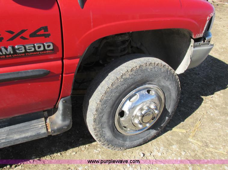 image for item K2231 2001 Dodge Ram 3500 Quad Cab flatbed pickup truck