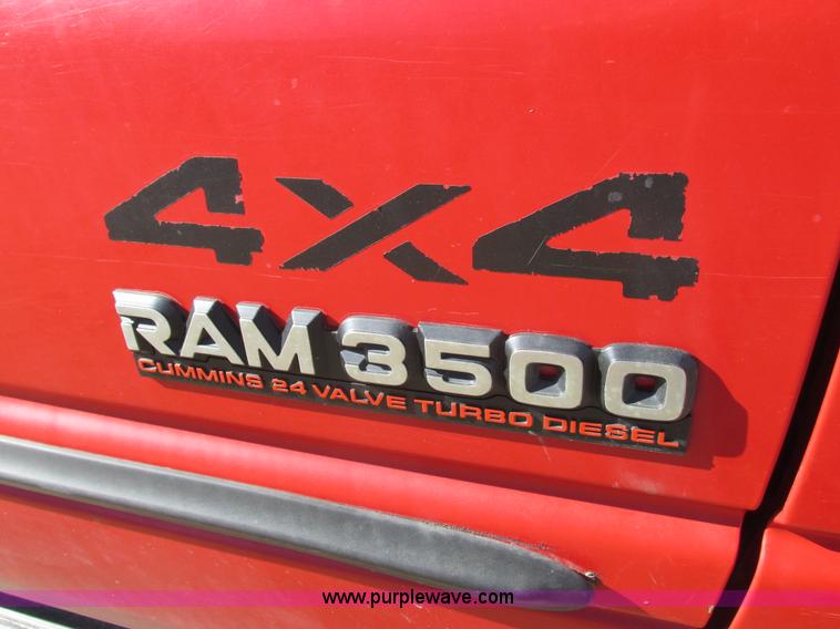 image for item K2231 2001 Dodge Ram 3500 Quad Cab flatbed pickup truck