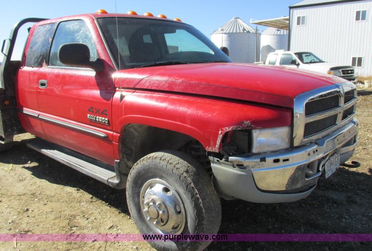 image for item K2231 2001 Dodge Ram 3500 Quad Cab flatbed pickup truck