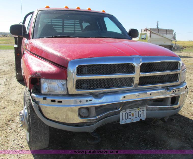 image for item K2231 2001 Dodge Ram 3500 Quad Cab flatbed pickup truck