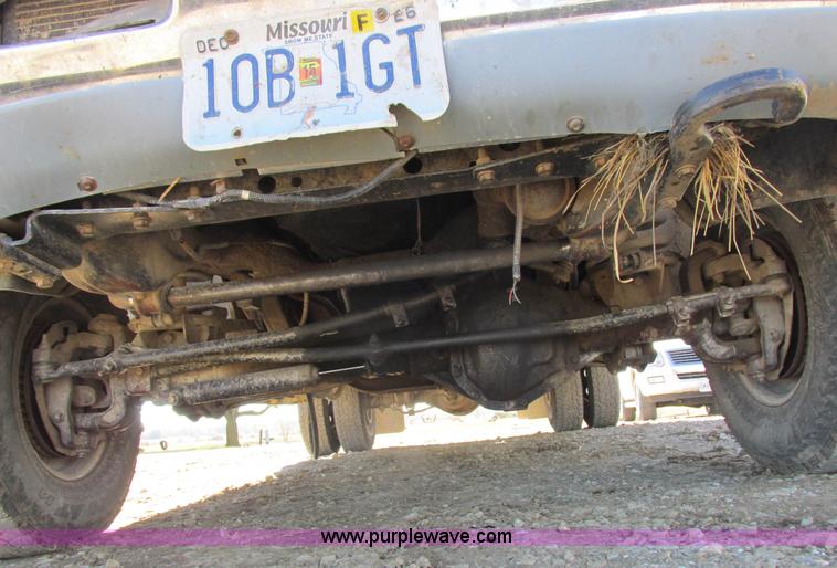 image for item K2231 2001 Dodge Ram 3500 Quad Cab flatbed pickup truck