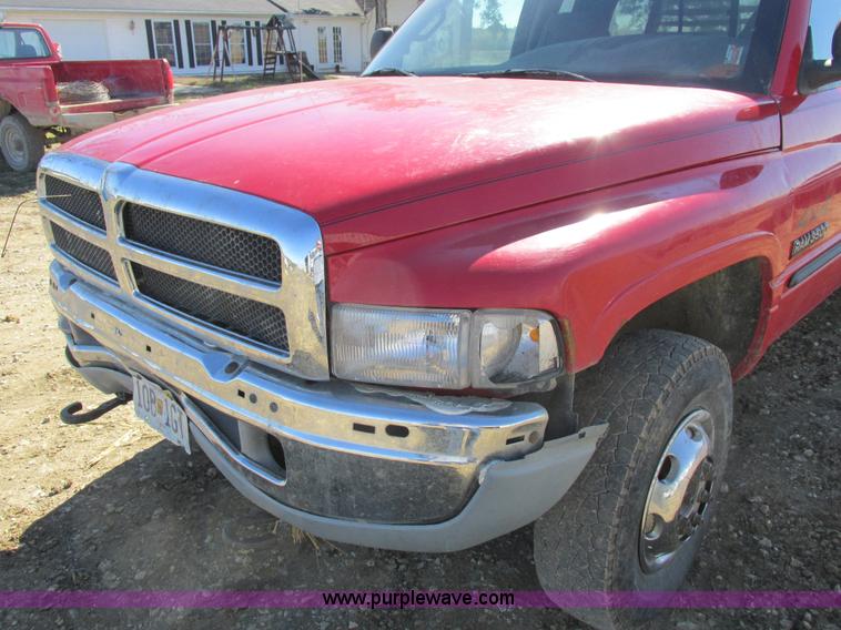 image for item K2231 2001 Dodge Ram 3500 Quad Cab flatbed pickup truck