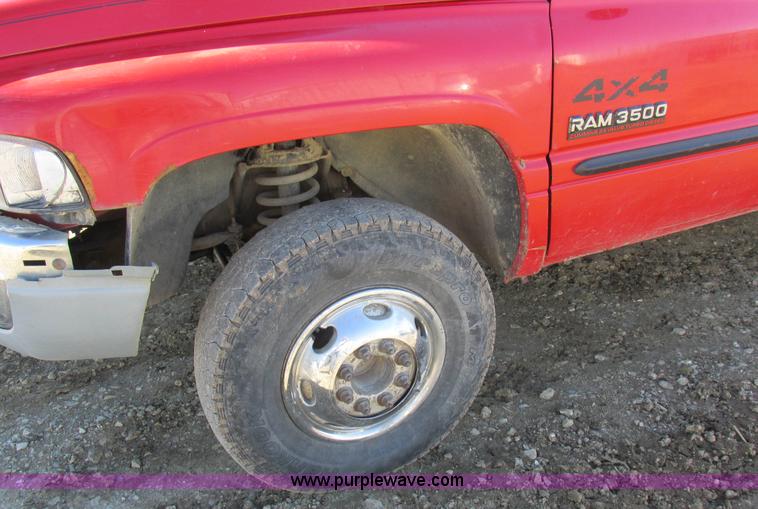 image for item K2231 2001 Dodge Ram 3500 Quad Cab flatbed pickup truck