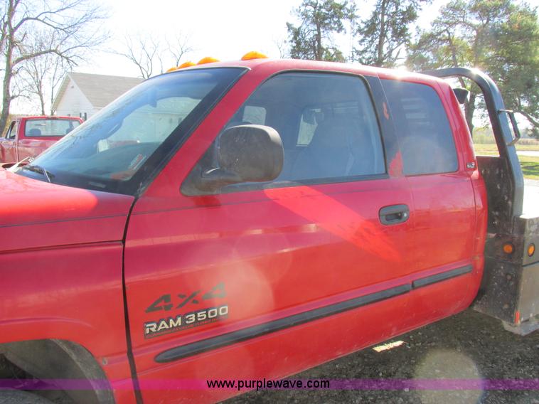 image for item K2231 2001 Dodge Ram 3500 Quad Cab flatbed pickup truck