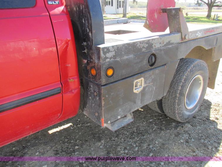 image for item K2231 2001 Dodge Ram 3500 Quad Cab flatbed pickup truck