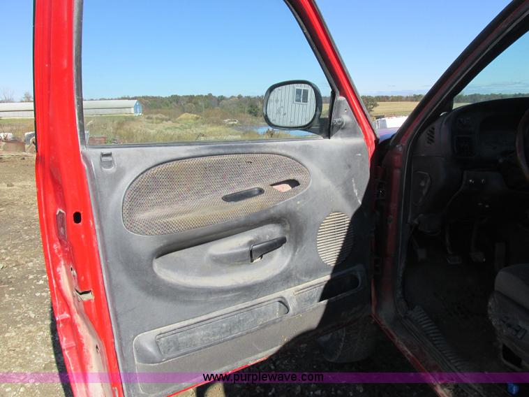 image for item K2231 2001 Dodge Ram 3500 Quad Cab flatbed pickup truck