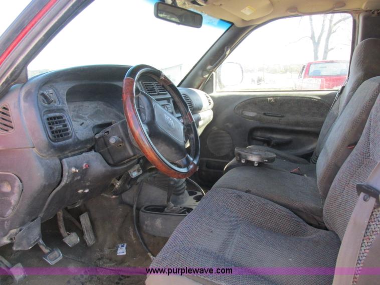 image for item K2231 2001 Dodge Ram 3500 Quad Cab flatbed pickup truck