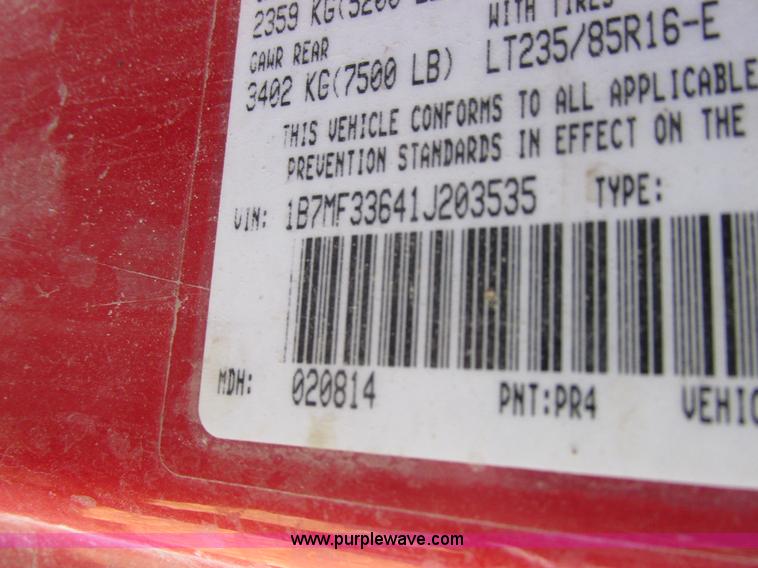 image for item K2231 2001 Dodge Ram 3500 Quad Cab flatbed pickup truck