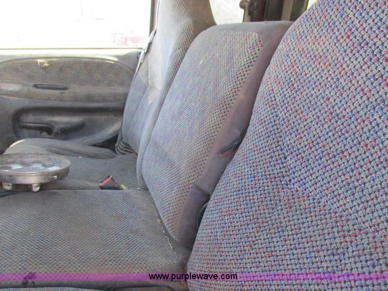 image for item K2231 2001 Dodge Ram 3500 Quad Cab flatbed pickup truck