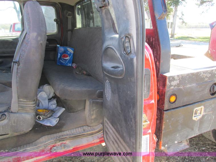 image for item K2231 2001 Dodge Ram 3500 Quad Cab flatbed pickup truck