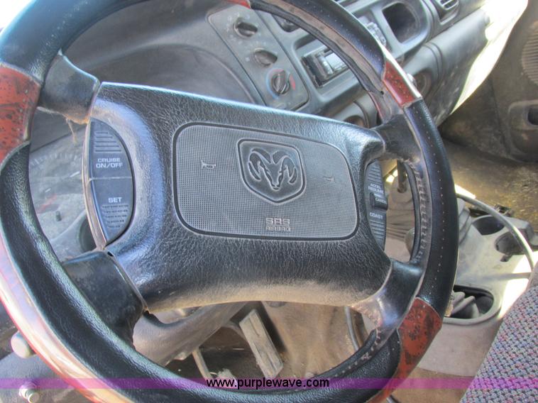 image for item K2231 2001 Dodge Ram 3500 Quad Cab flatbed pickup truck