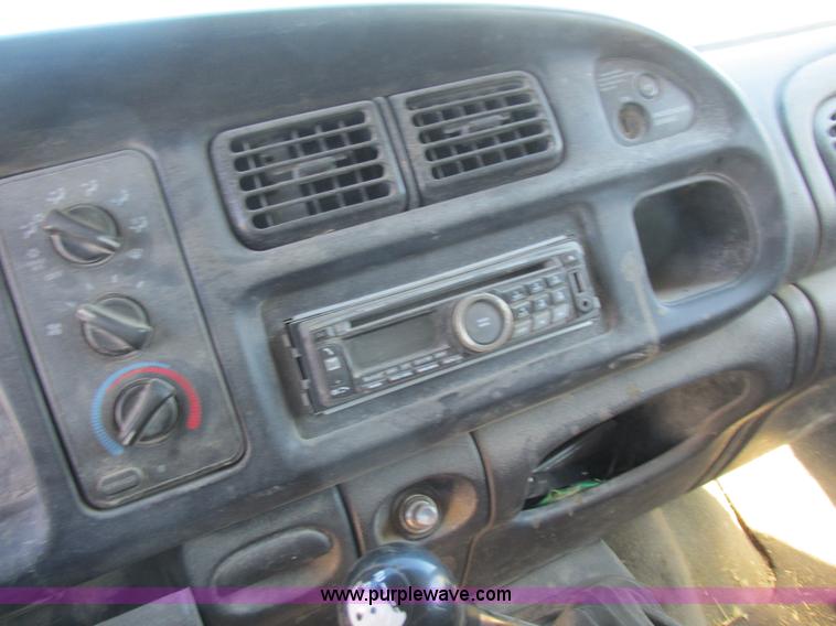 image for item K2231 2001 Dodge Ram 3500 Quad Cab flatbed pickup truck