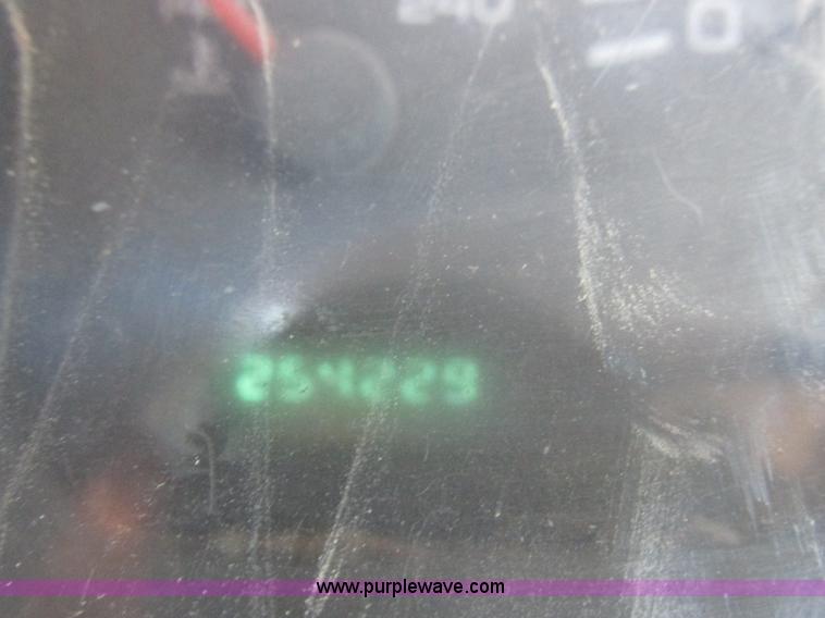 image for item K2231 2001 Dodge Ram 3500 Quad Cab flatbed pickup truck